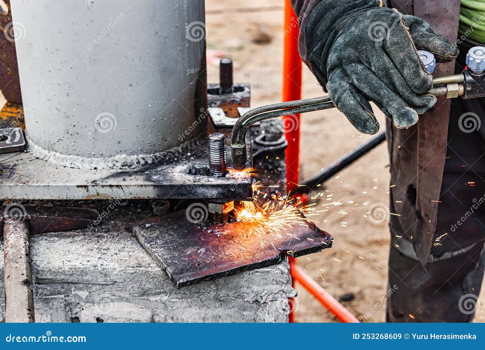 Worker Cutting Metal Plate by Gas Cutting Torch at a Construction Site