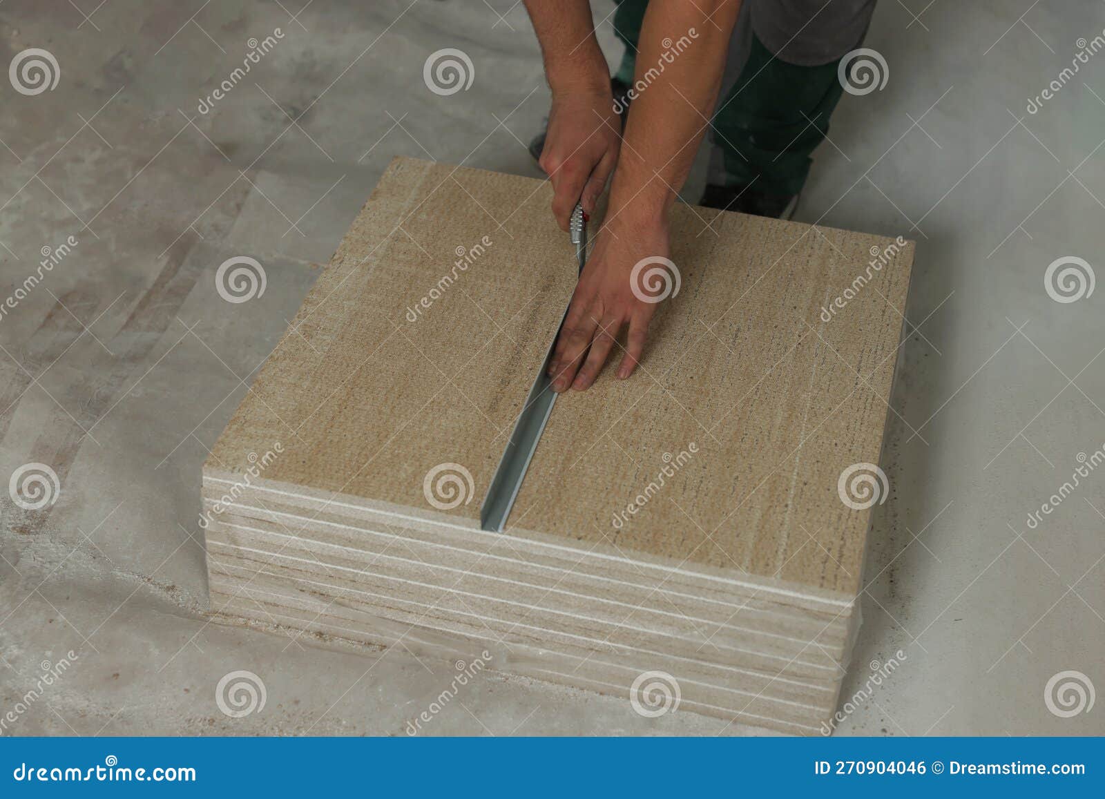 Worker Cutting PVC Ceiling Tile on Floor, Closeup Stock Photo Image