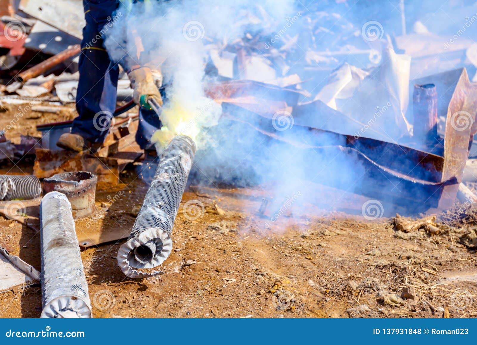 Worker is Cutting Scrap Metal with Acetylene Torch Stock Photo - Image