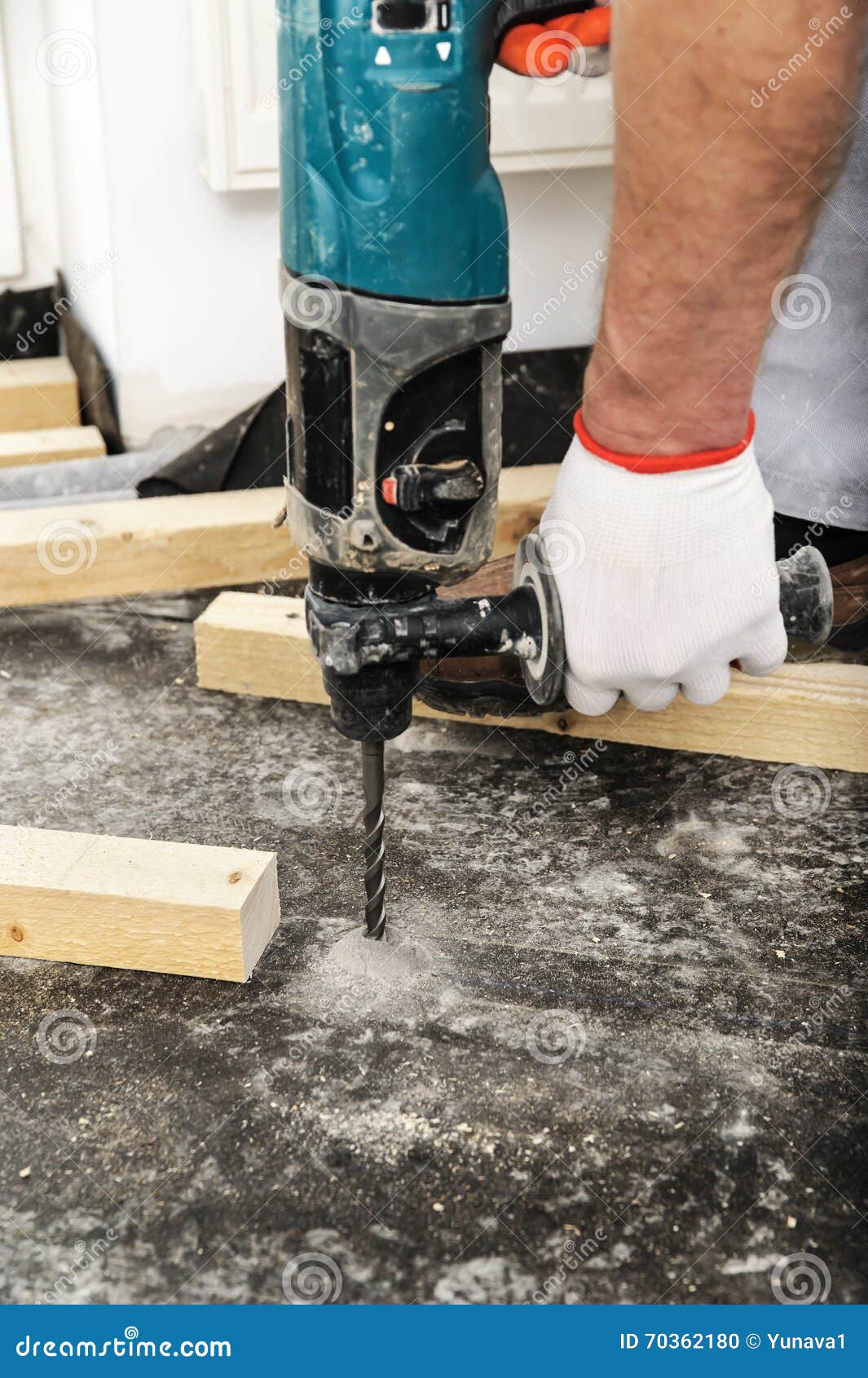 Worker With A Drill Drills A Hole In The Iron Structure RoyaltyFree