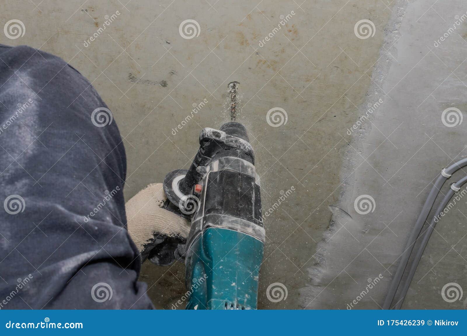Worker Drills a Concrete Wall with a Hammer Drill Stock Image Image