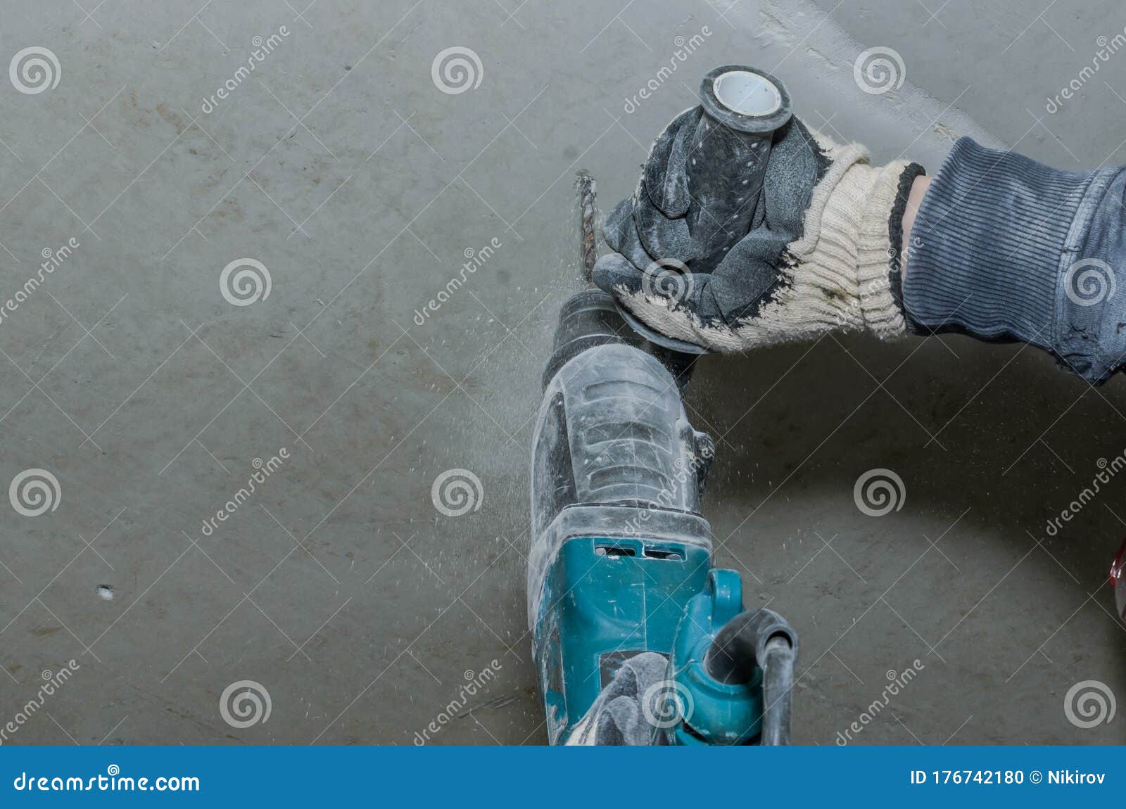 Worker Drills a Concrete Wall with a Hammer Drill Stock Photo Image of helmet, construction