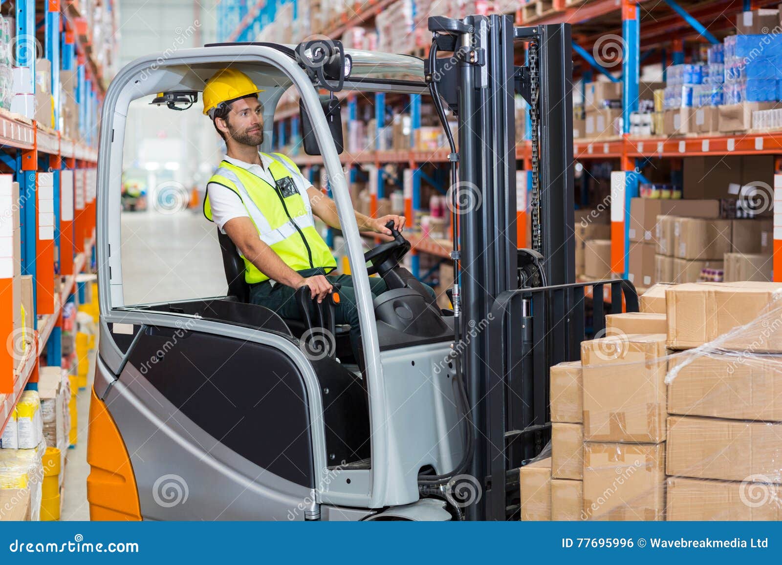 Worker is Driving a Pallet Truck Stock Photo Image of concentrated
