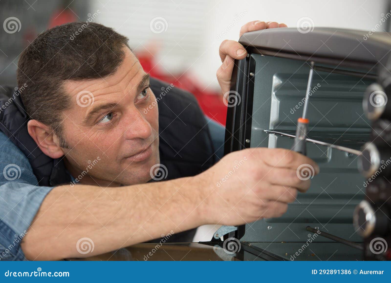 Worker Estimating Cost for Broken Oven Stock Photo Image of