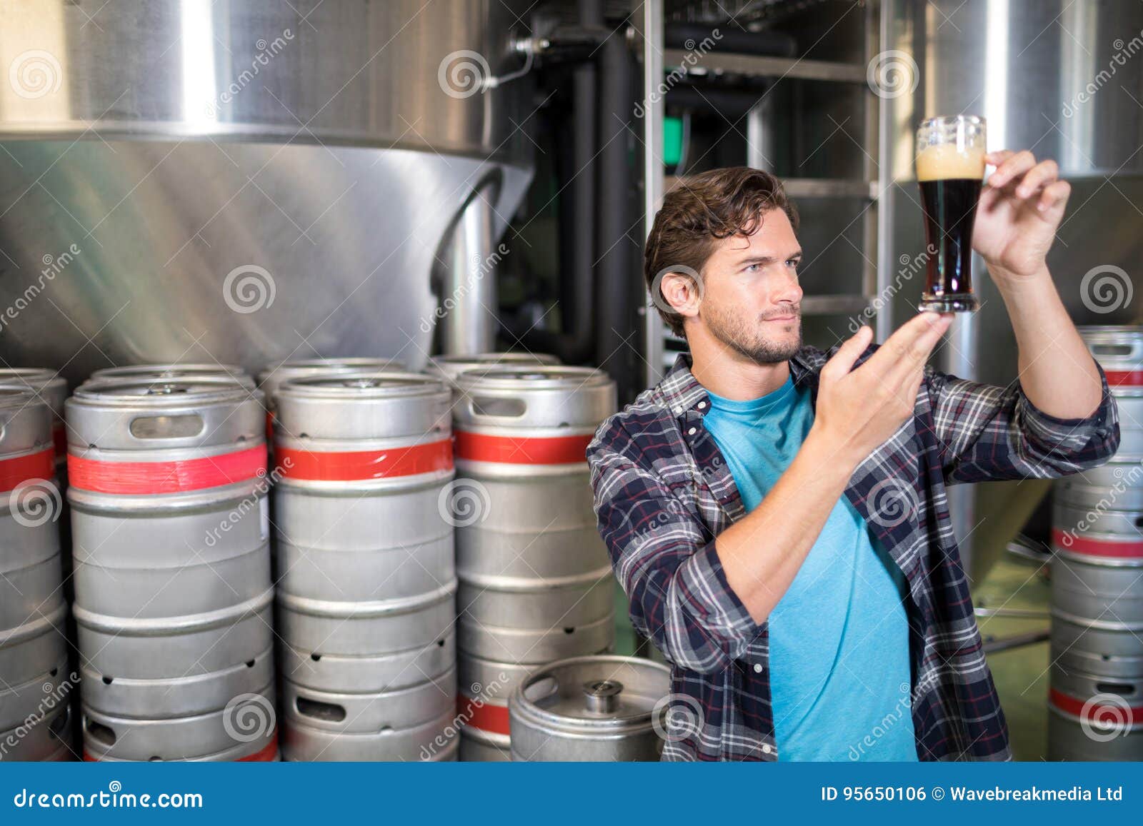 Worker Examining Beer at Warehouse Stock Photo Image of casual, alcohol 95650106