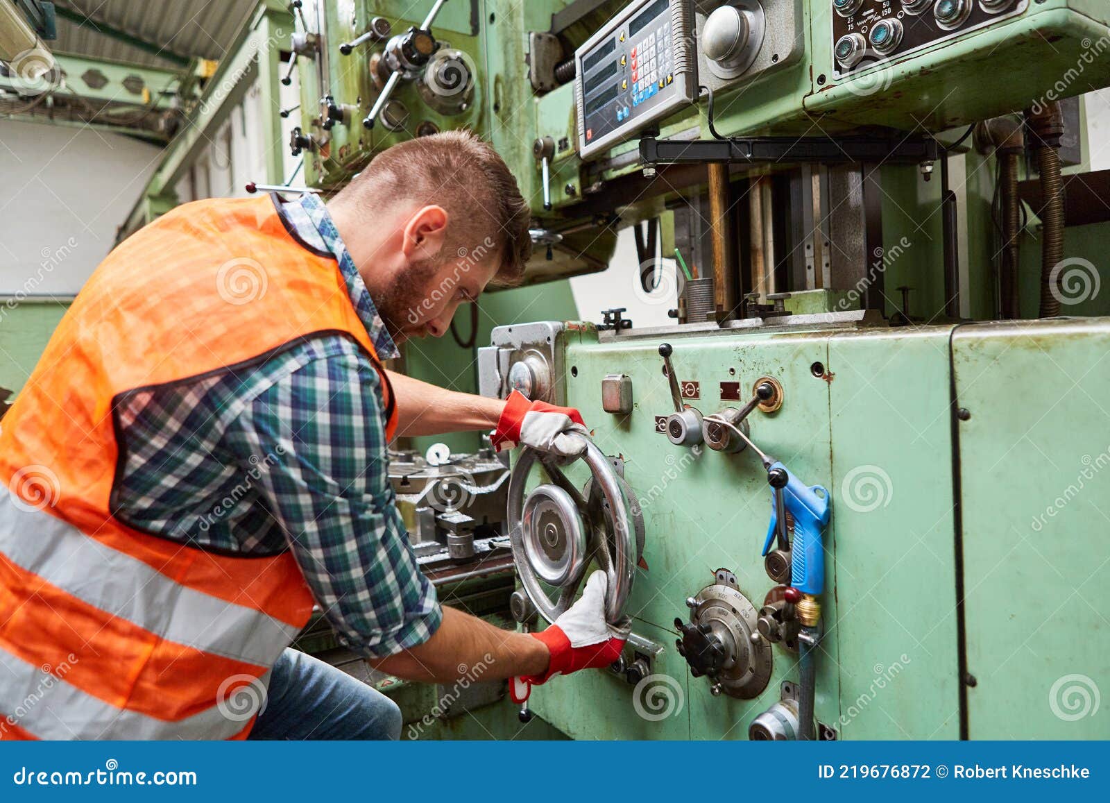 Worker in Factory Operates Drill Press on Wheel Stock Photo Image of
