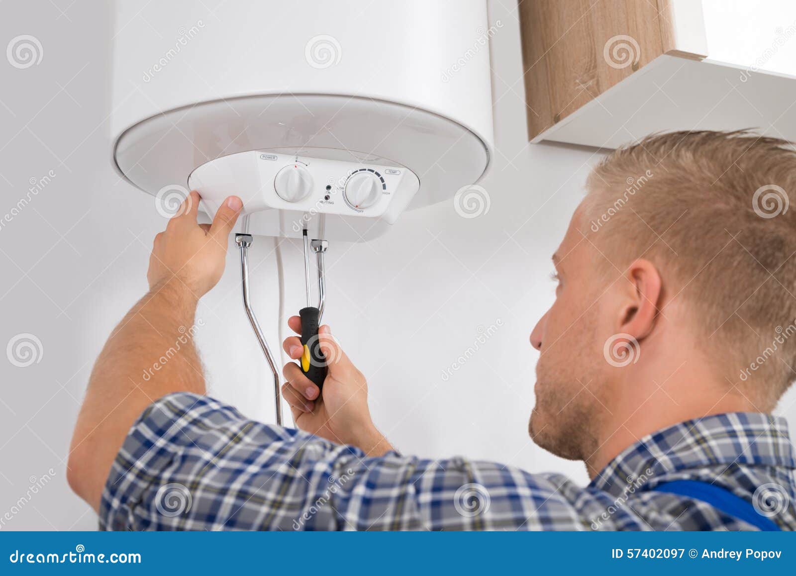 worker fixing electric boiler