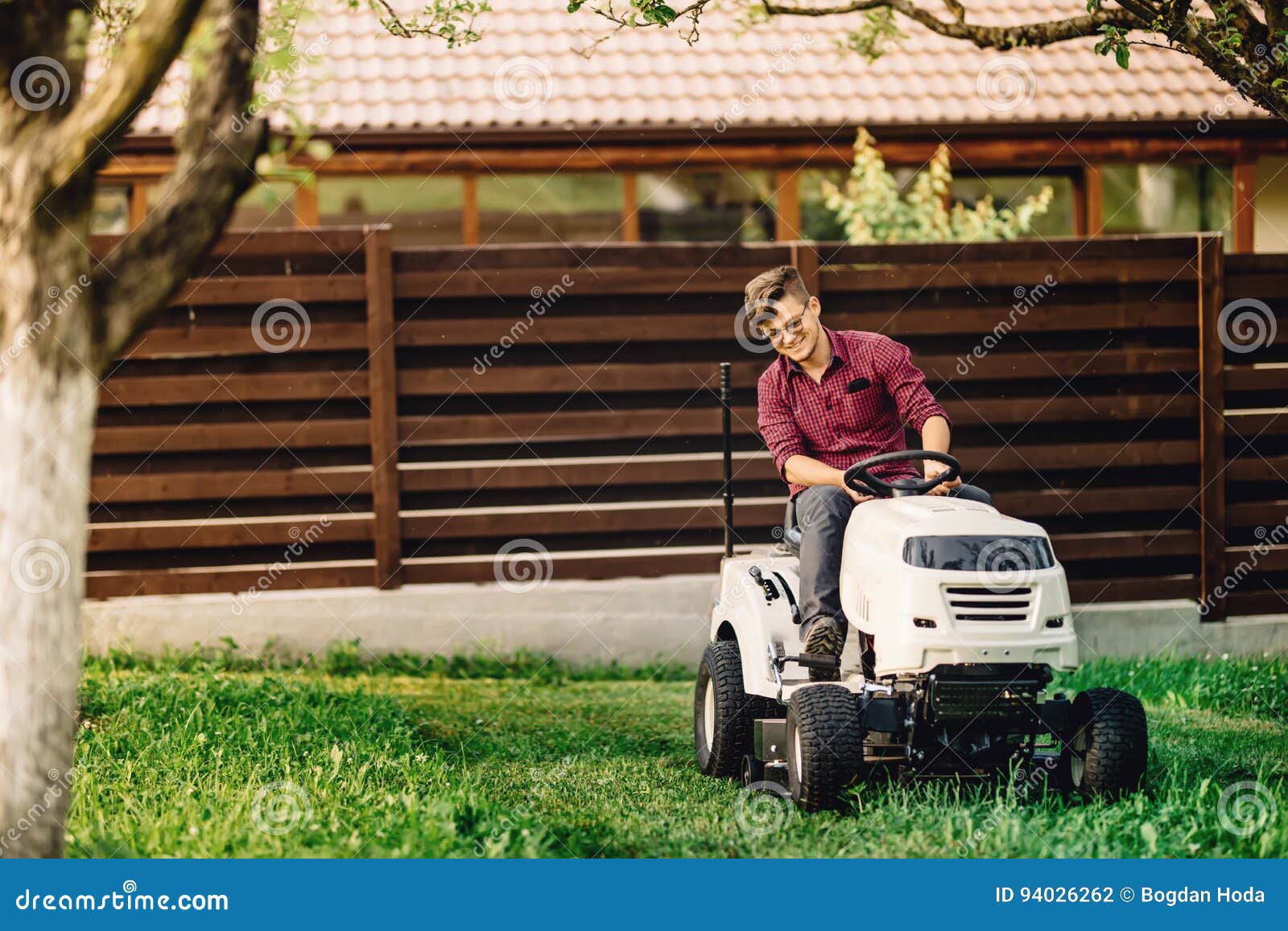 Worker Gardening and Doing Landscaping Works, Using Professional Tools