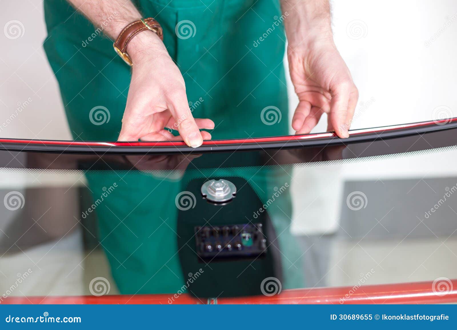 Worker in Glazier S Preparing Sealing for Windscreen Stock
