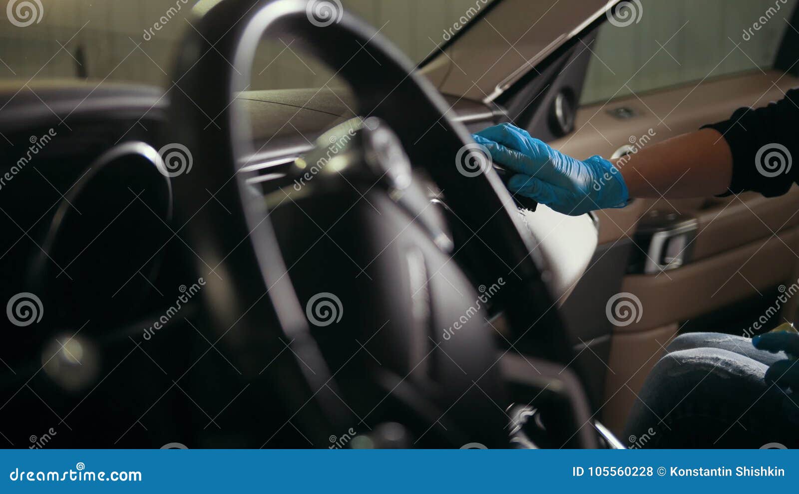 Worker In Gloves Is Puting Cream On The Brush And Washing A Car Interior