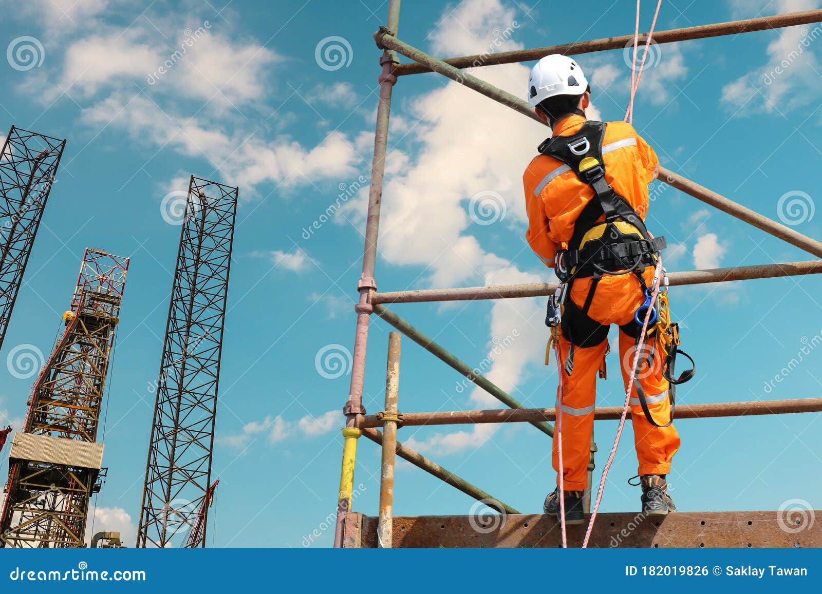 worker on high on scaffolding