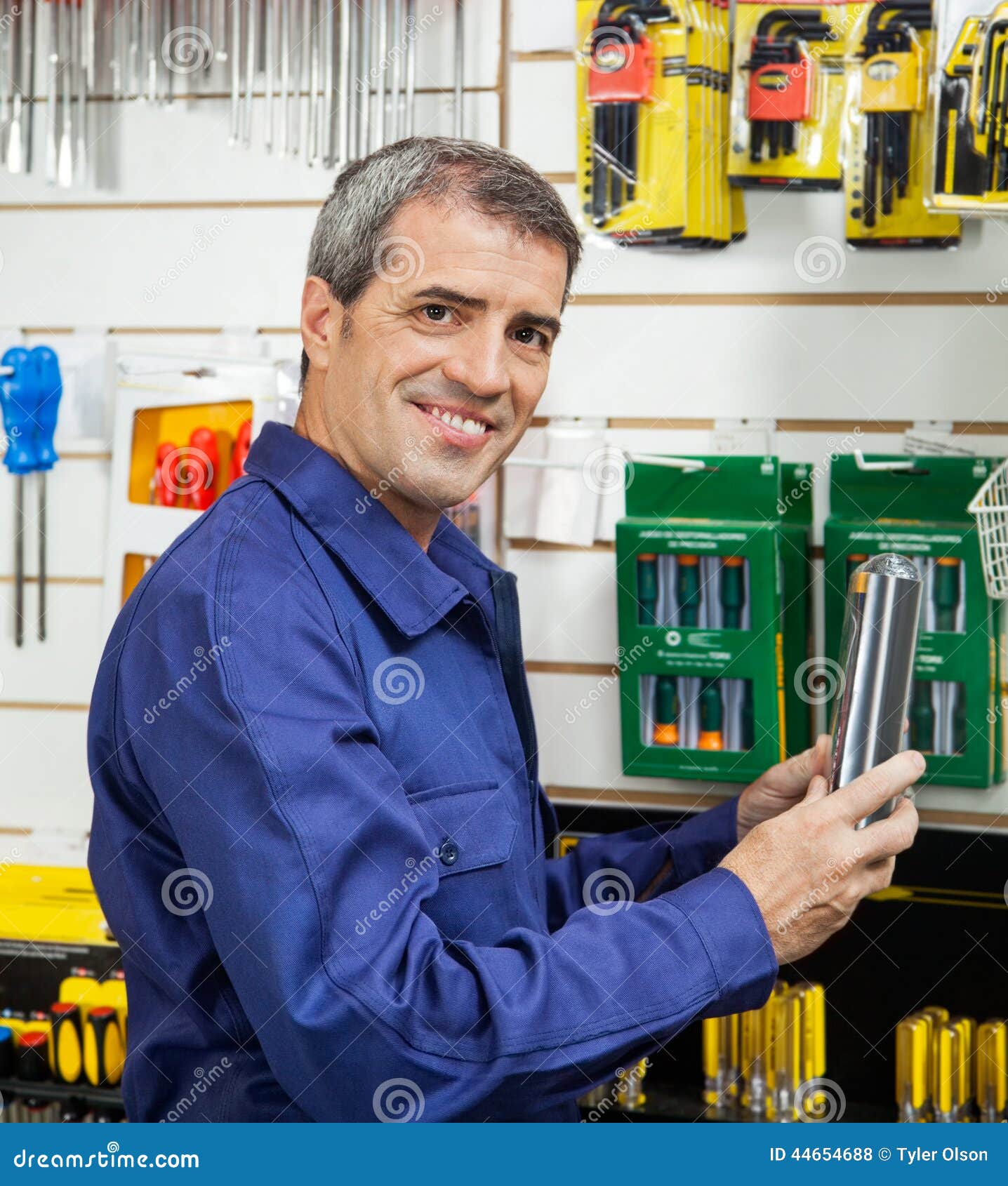 Worker Holding Packed Product in Hardware Store Stock Photo Image of
