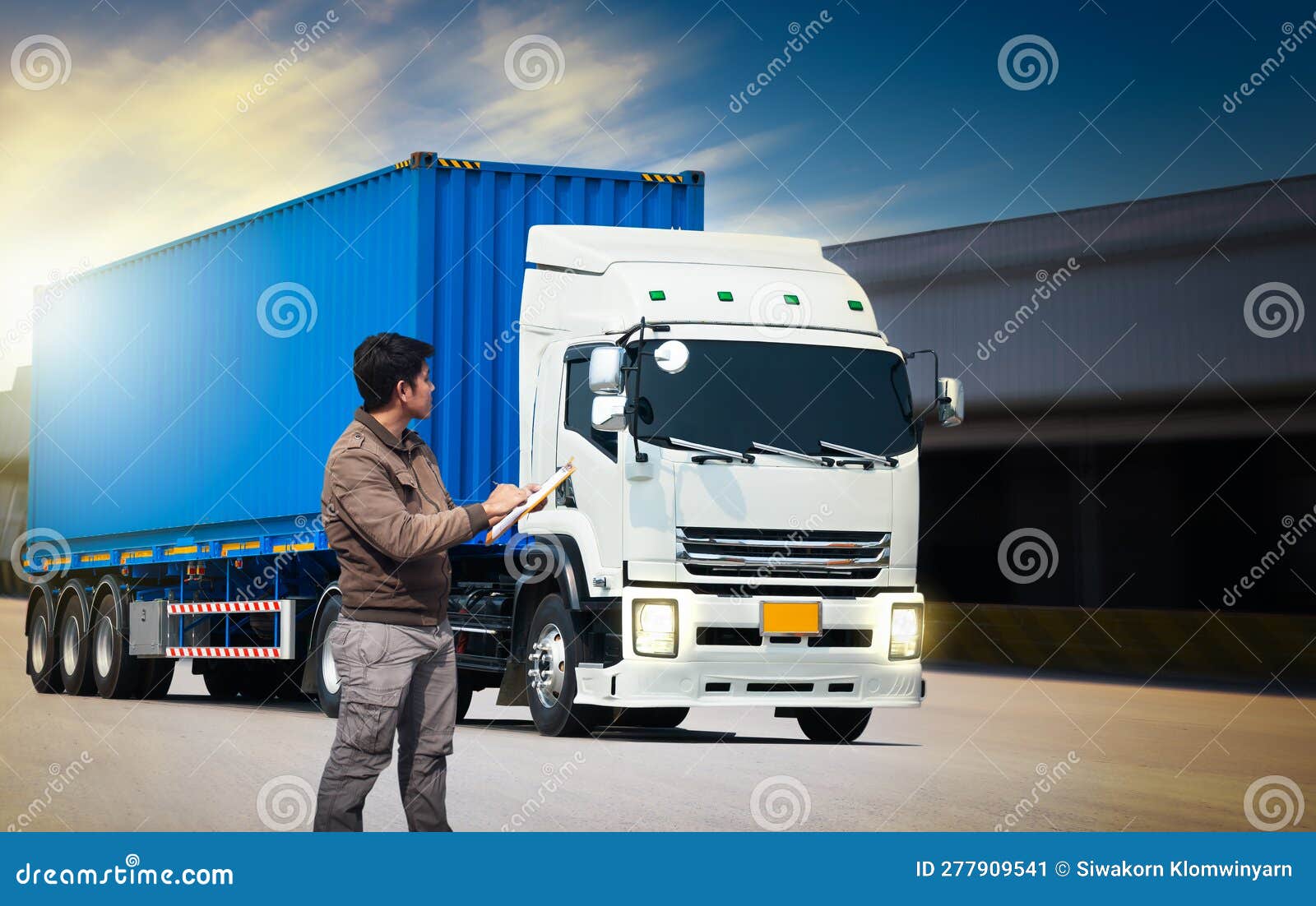 Worker Holds a Clipboard Checking the Loading of Trailer Truck. Freight