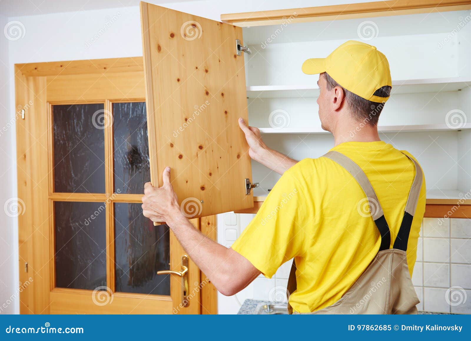 Worker Installing Kitchen Cupboard Stock Image Image of repairman