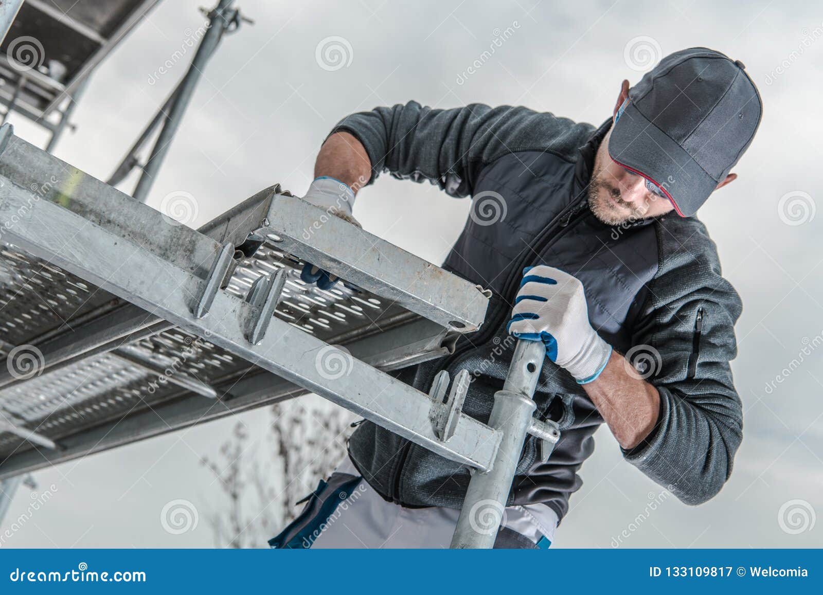 worker installing scaffolding