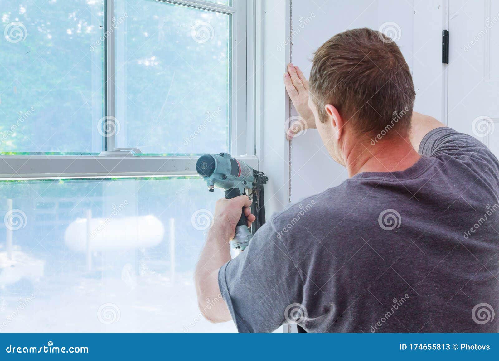 Worker Installing Trim Around a Window Stock Image Image of carpentry, framer 174655813