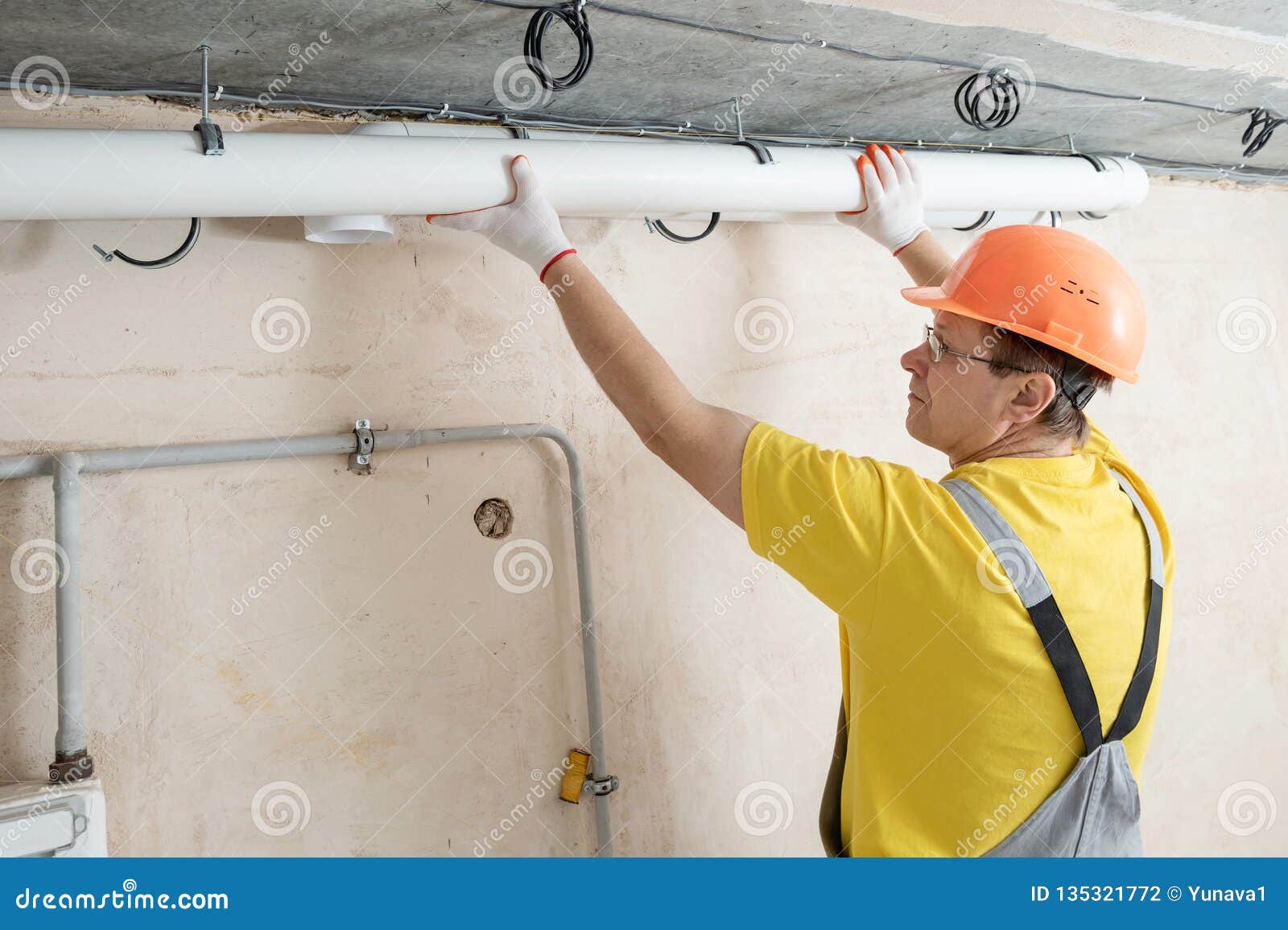 The Worker is Installing a Ventilation System Stock Photo Image of