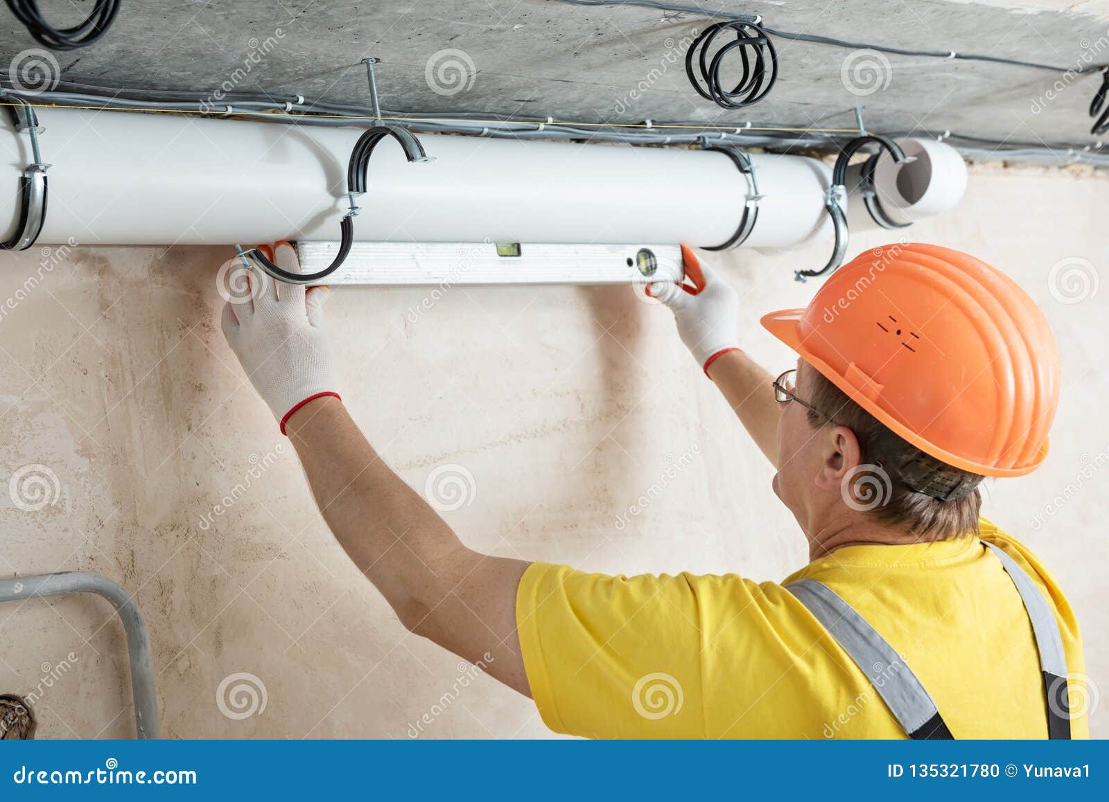 The Worker is Installing a Ventilation System Stock Photo Image of