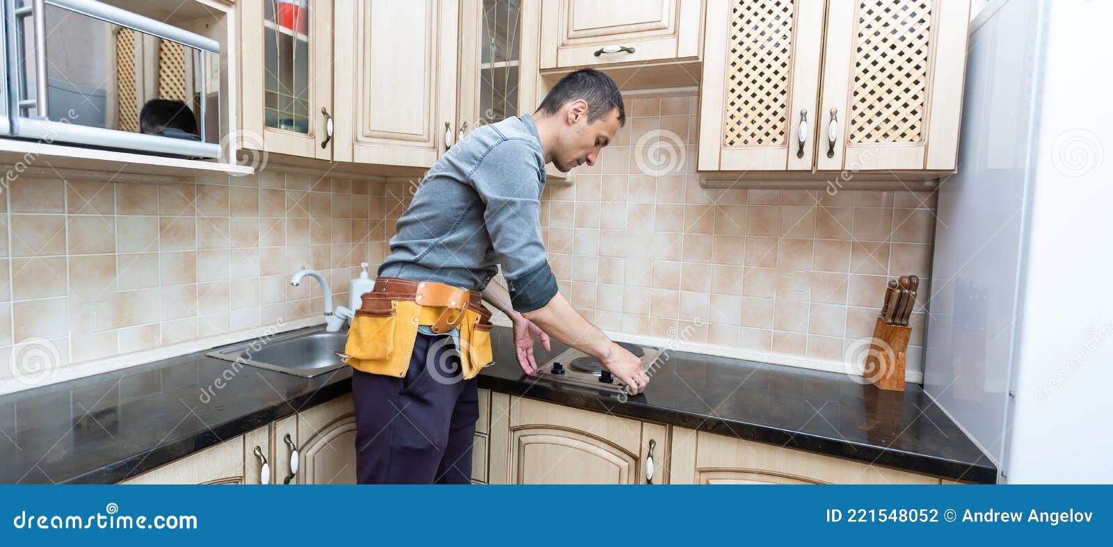 The Worker Installs an Electric Stove Stock Photo Image of electric