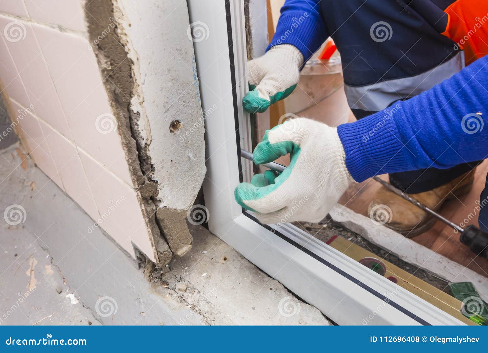 The Worker Installs Plastic Windows and Doors Stock Photo Image of