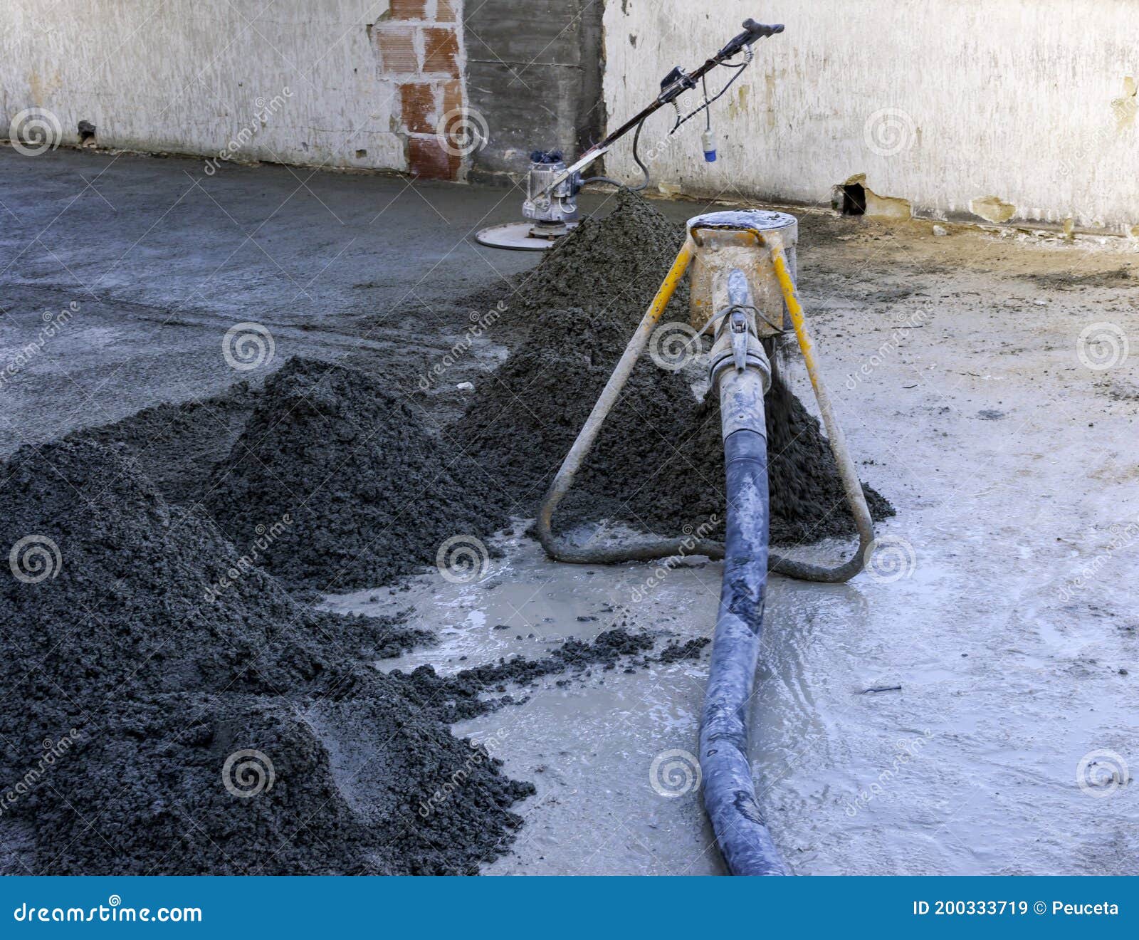 Worker on a Laser Screed Machine Leveling Fresh Poured Concrete Surface