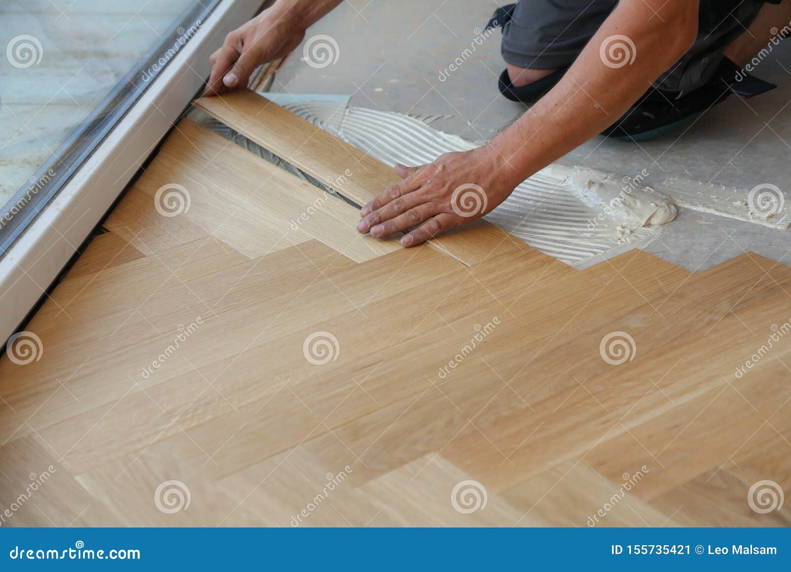 Worker Laying Parquet Flooring Worker Installing Wooden Laminate