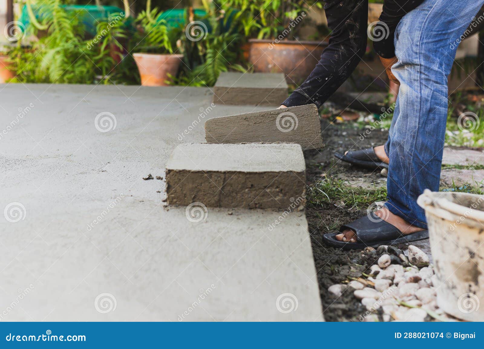 Worker Leveling Concrete Cement Floor Using Trowel. Stock Photo Image of foundation, grey