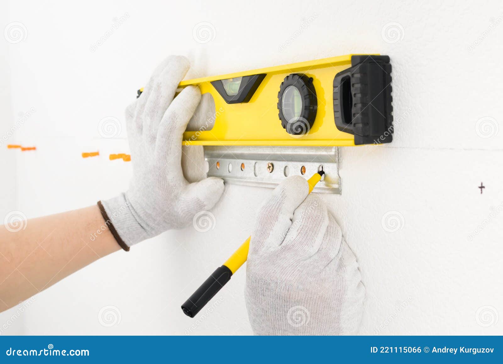 The Worker Marks the Level of the Attachment Point of the Fasteners for