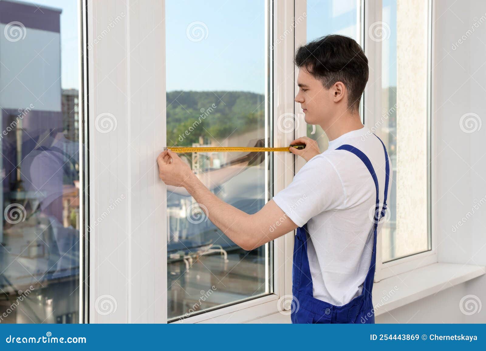 Worker Measuring Plastic Window. Installation Process Stock Image