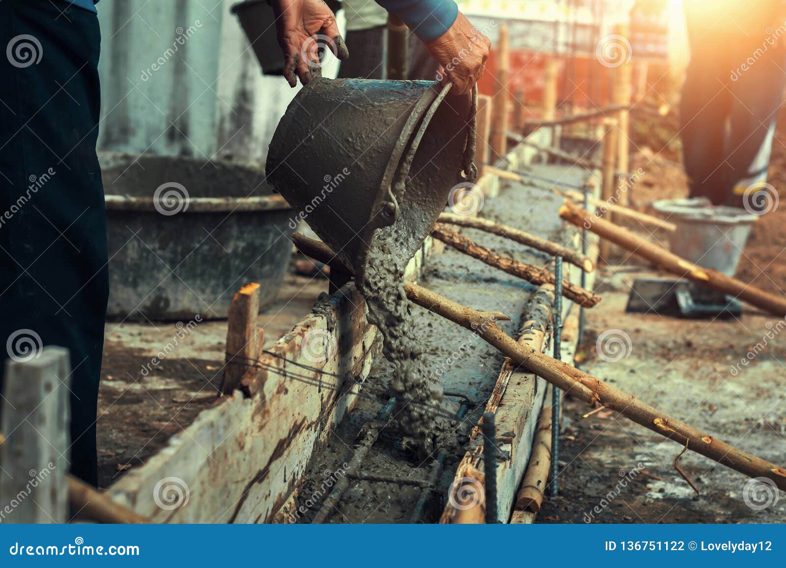 Worker Mixing Pour Construction Cement on Floor for Building Stock