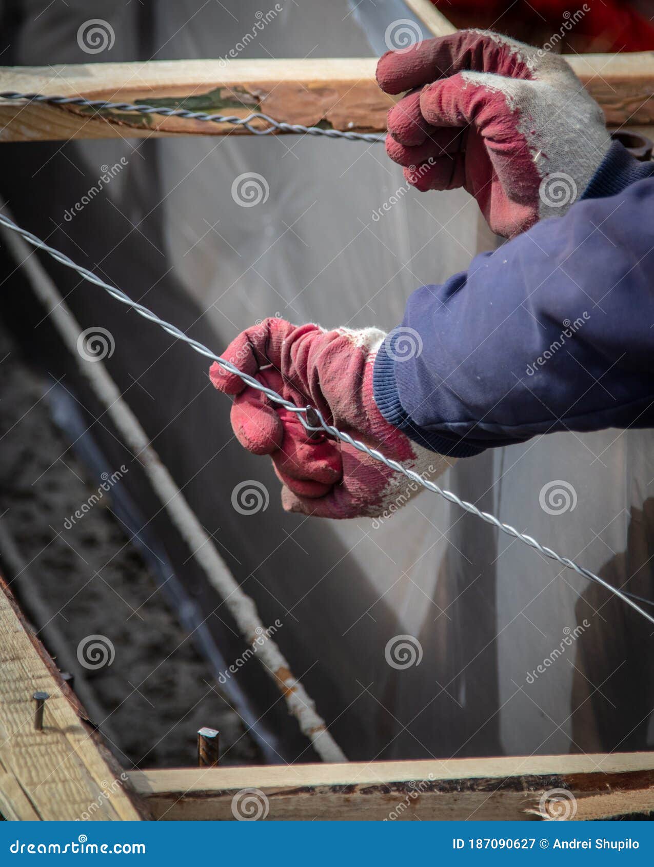 Worker Nails a Wire at a Construction Site at Home Stock Image Image