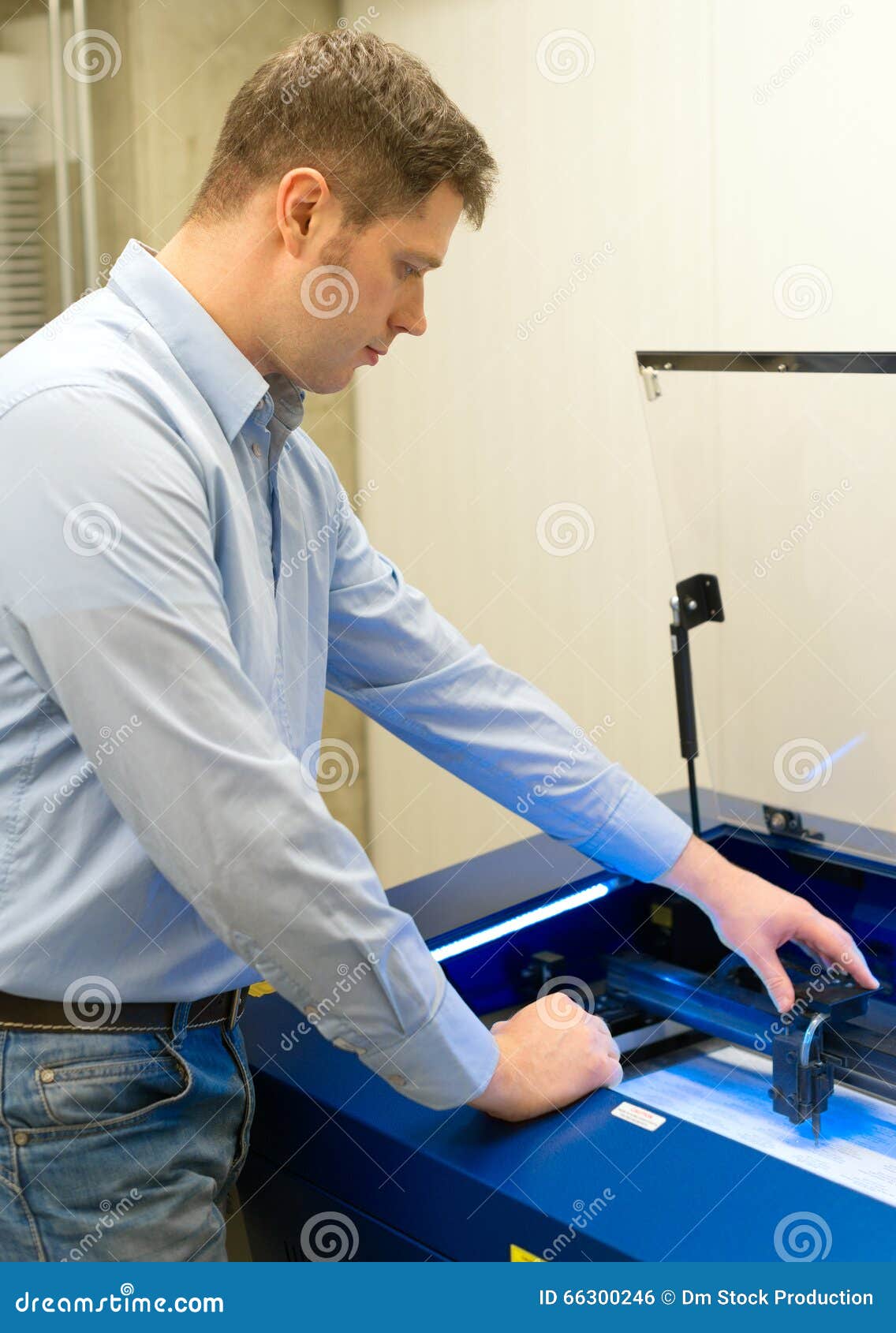 Worker Near Laser Engraving Machine. Stock Photo Image of mechanical