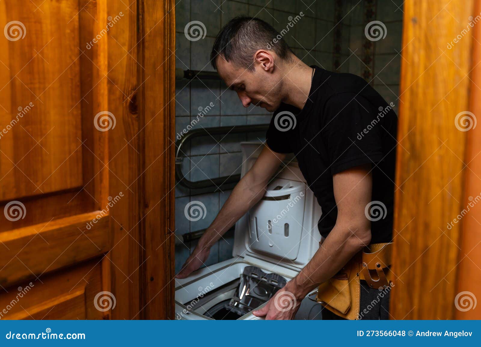 A Worker and an Old Washing Machine Stock Photo Image of laundry