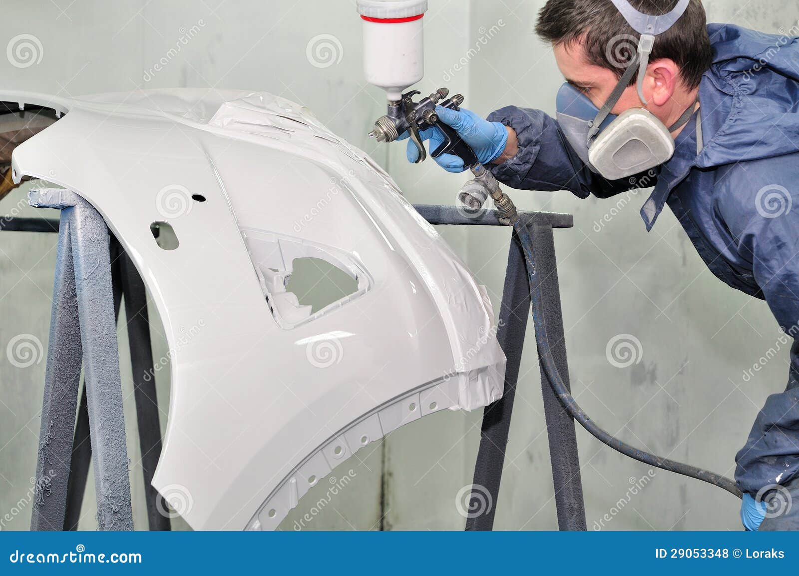 Worker Painting a Car Bumper. Stock Photo Image of color, mechanic