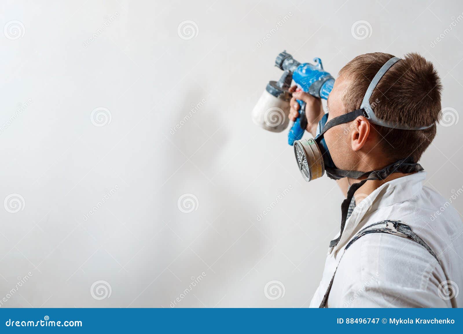 Worker Painting Wall with Spray Gun in White Color. Stock Image Image