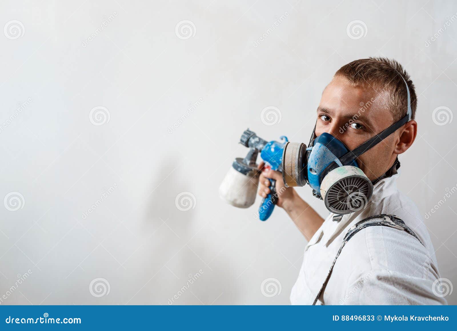 Worker Painting Wall with Spray Gun in White Color. Stock Image Image