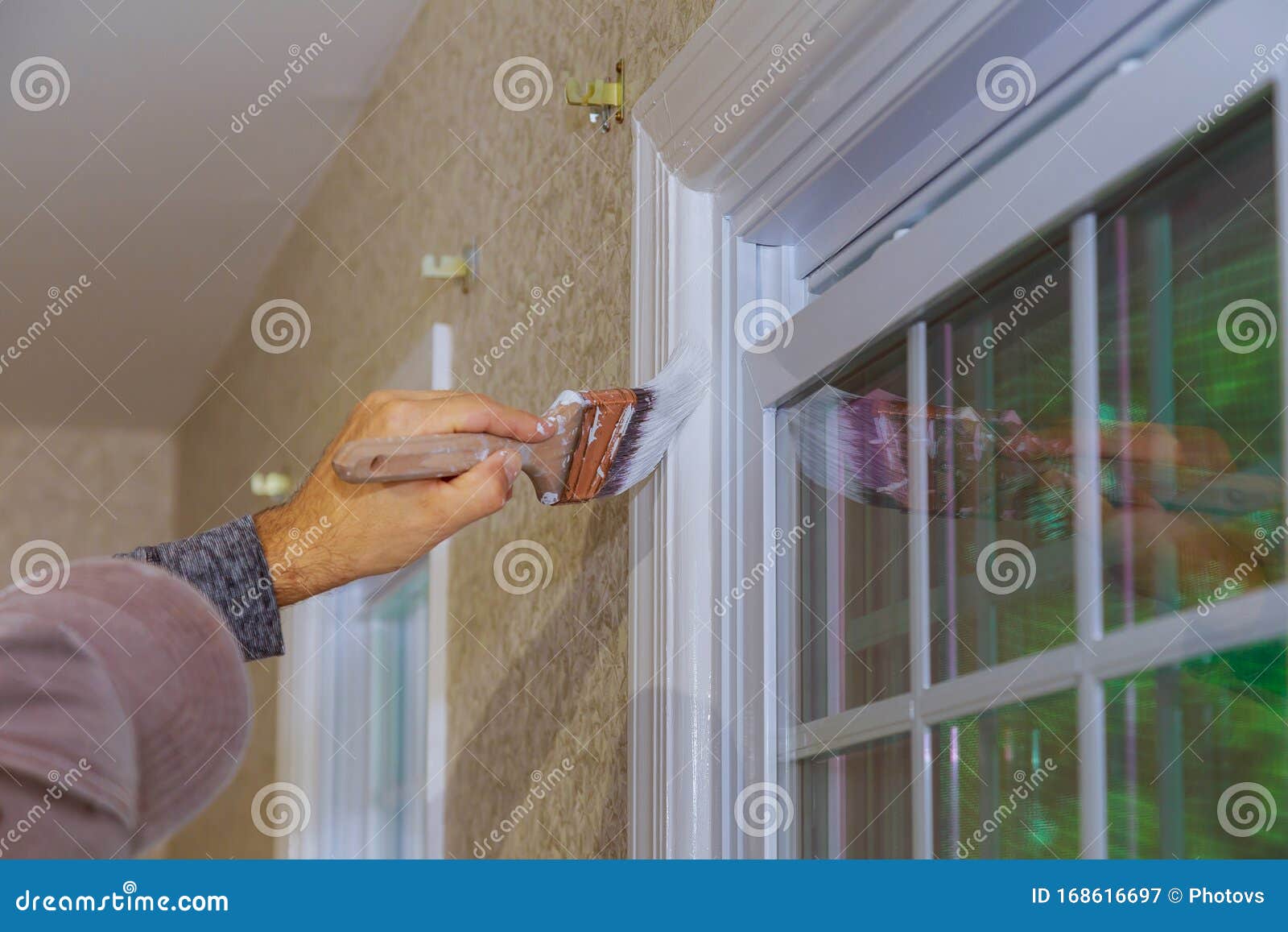 Worker Painting Wooden Window Frame Using Paintbrush Stock Image