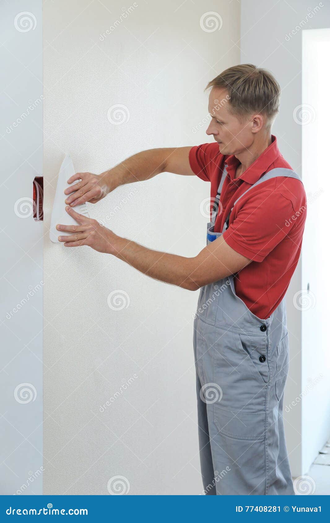 Worker pasting wallpapers. stock image. Image of paintbrush 77408281