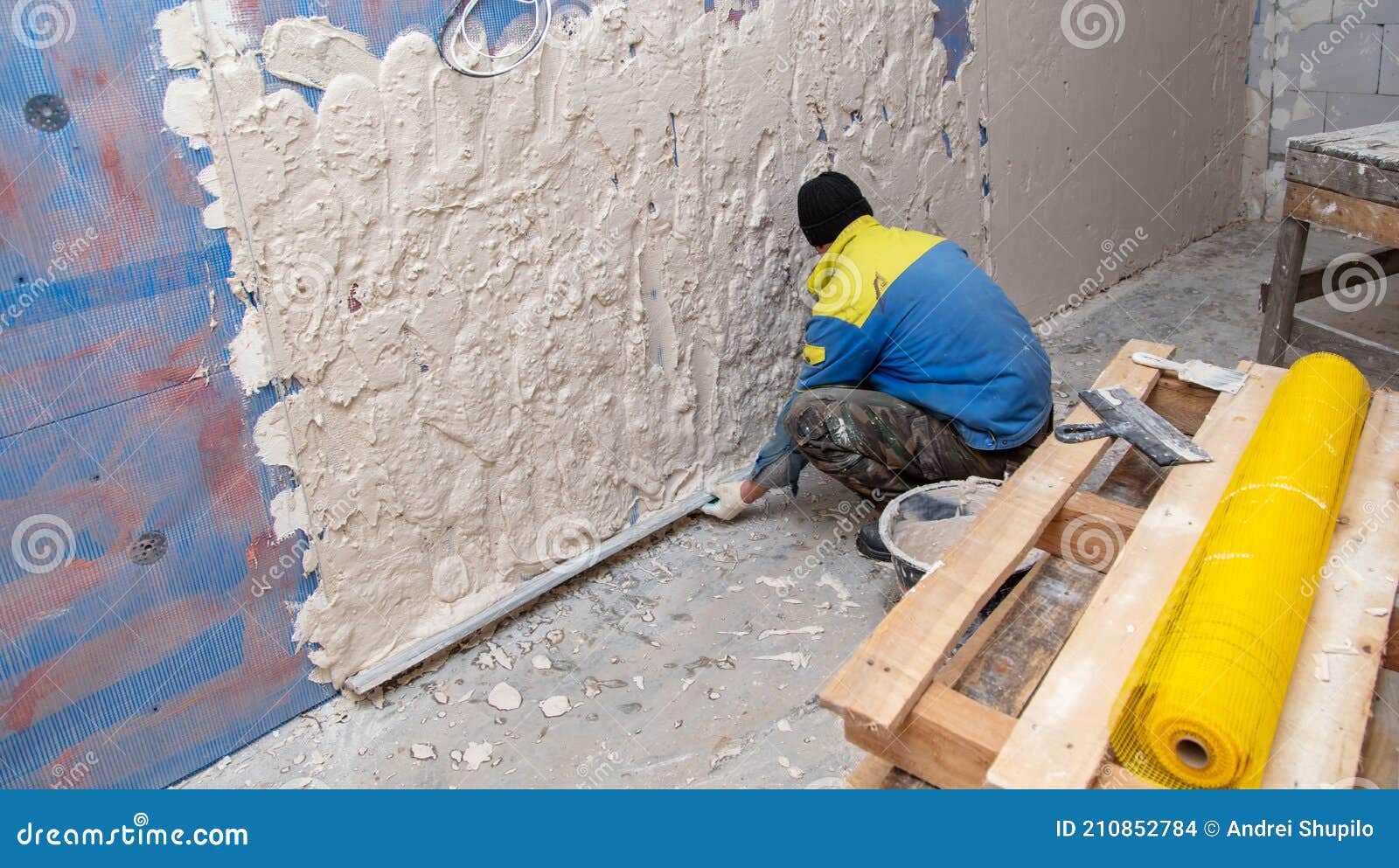 A Worker Plasters the Walls in the Room Stock Photo Image of tool