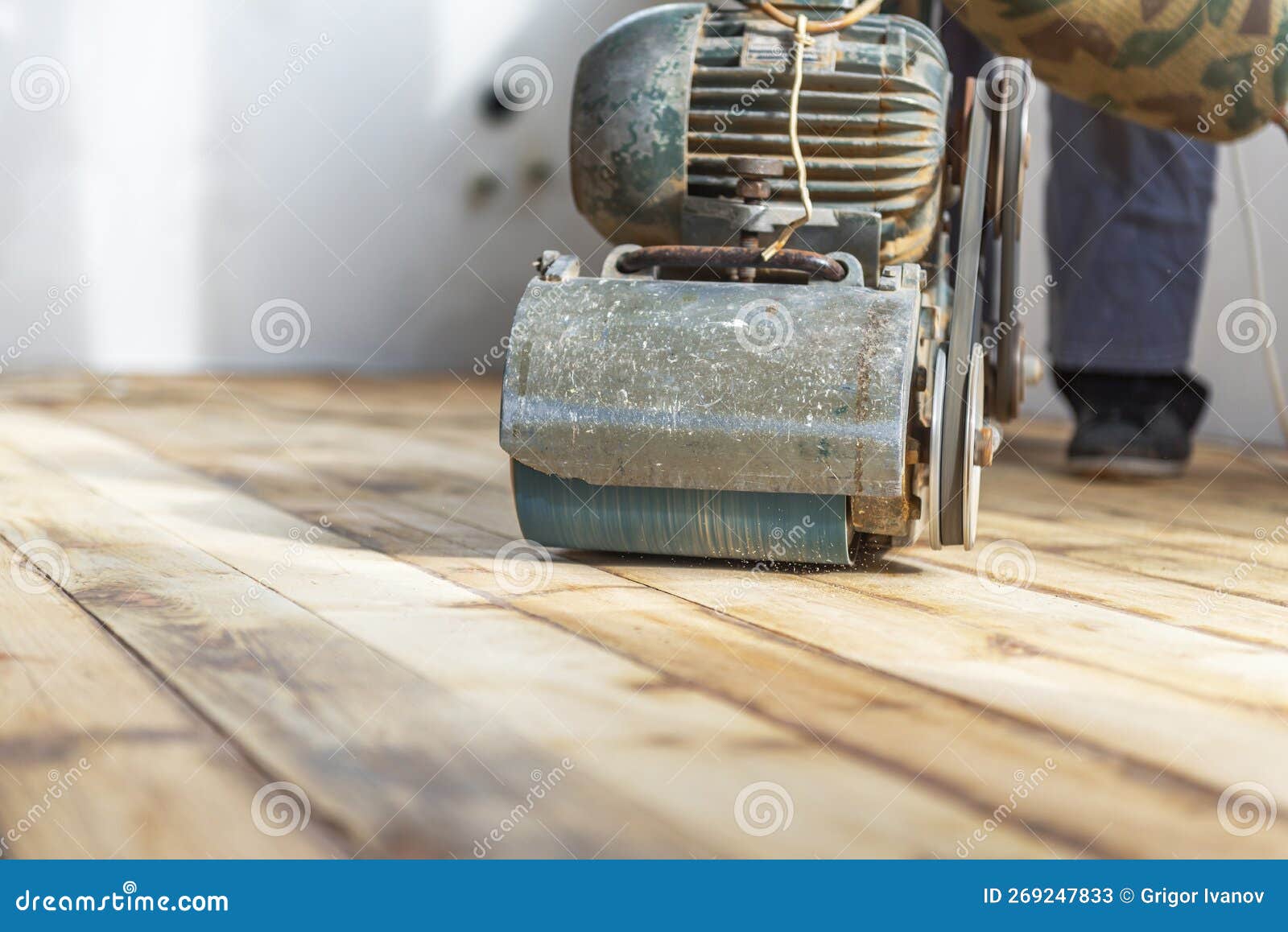 Worker Polishing Parquet Floor with Grinding Machine Stock Image