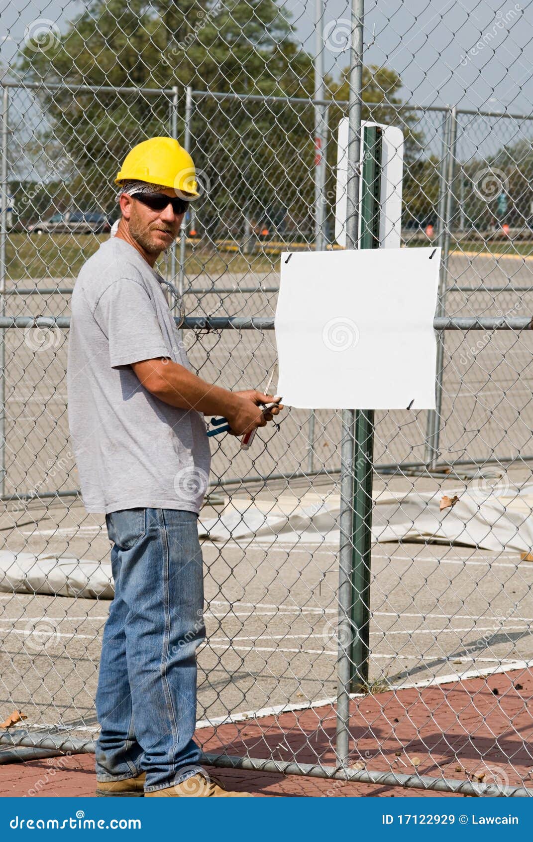 worker posting blank sign