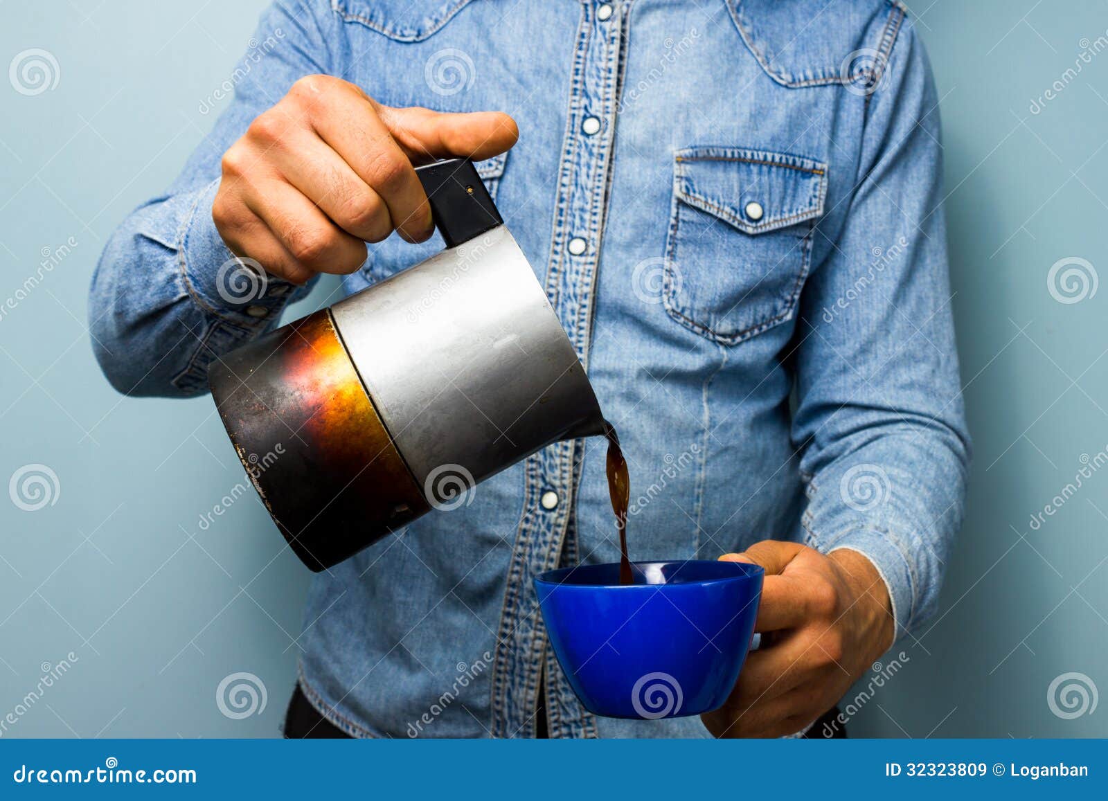 worker pouring coffee from moka pot