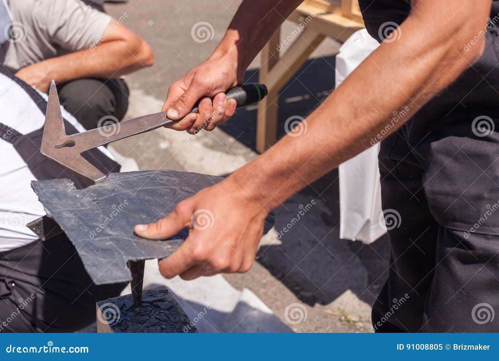 Worker Produces Roofing Slate Using a Slate Hammer. Stock Image Image