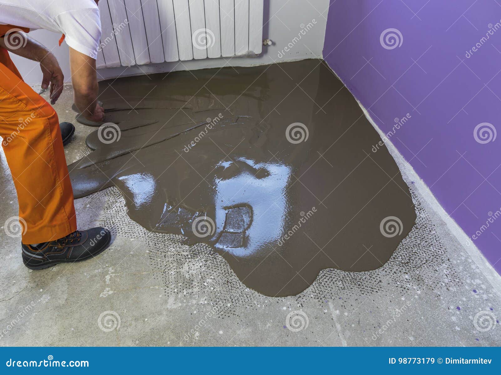 Worker Puts A Self Leveling Screed With Tool On Concrete Floor I