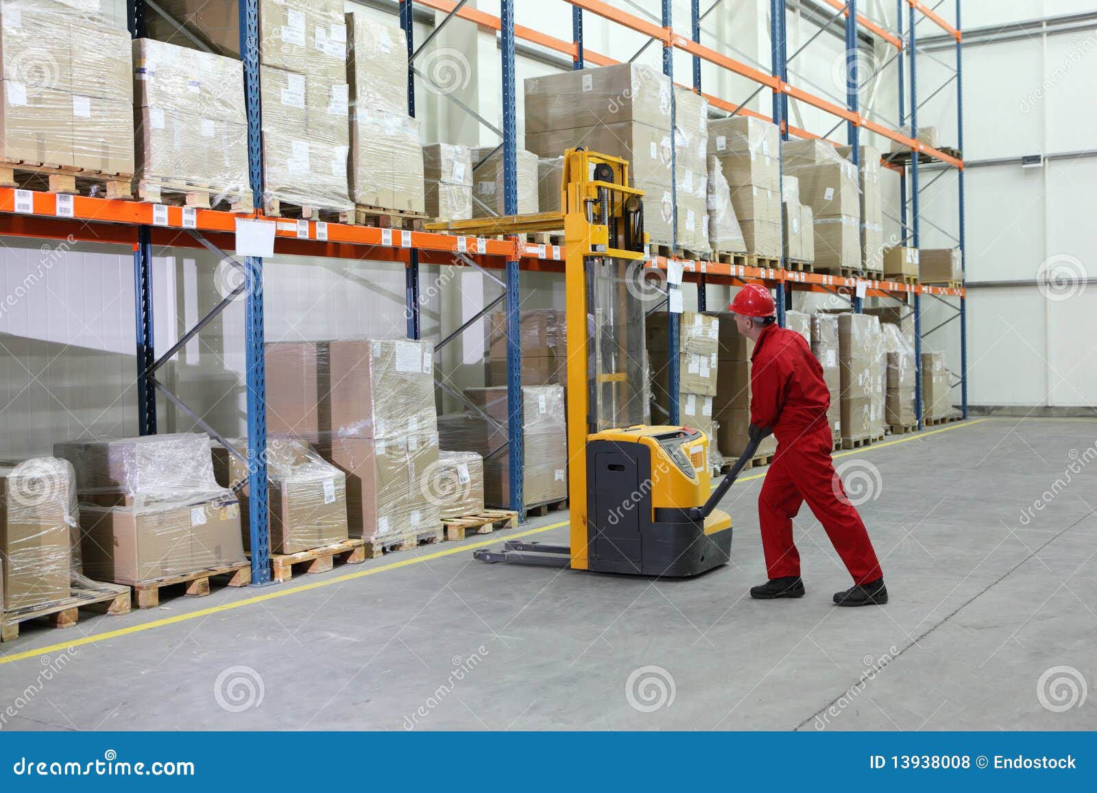 Worker In Red Uniform At Work In Warehouse Stock Photo - Image of