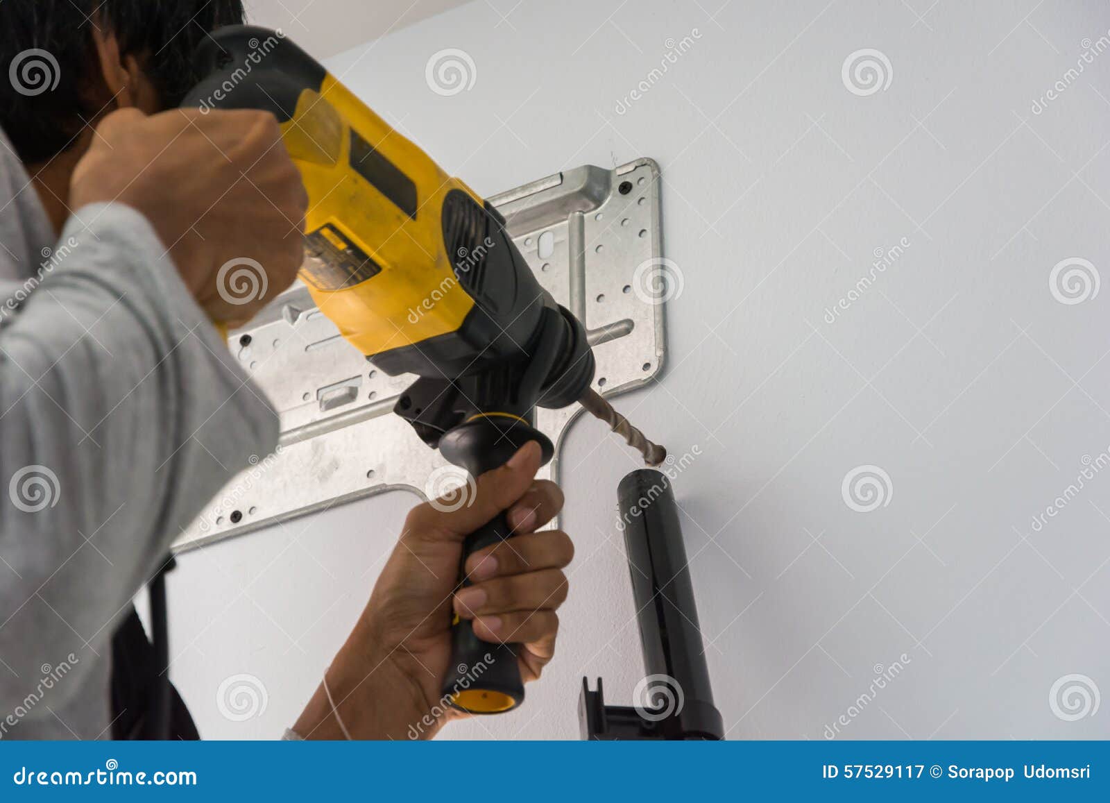 Worker insulating a room wall with mineral rock wool thermal insulation., Stock image