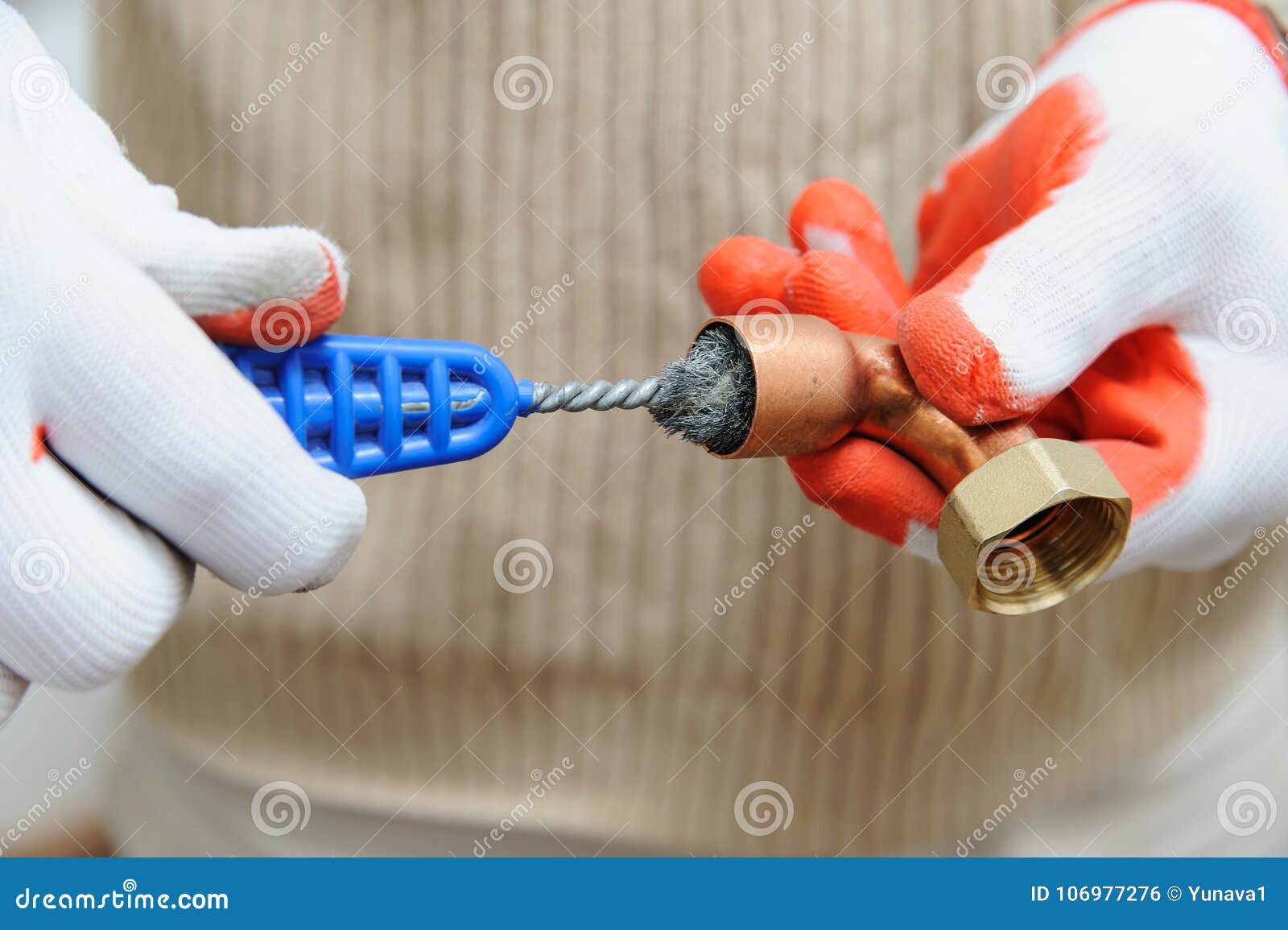 A Worker is Rubbing the Copper Tube. Stock Photo Image of repairman
