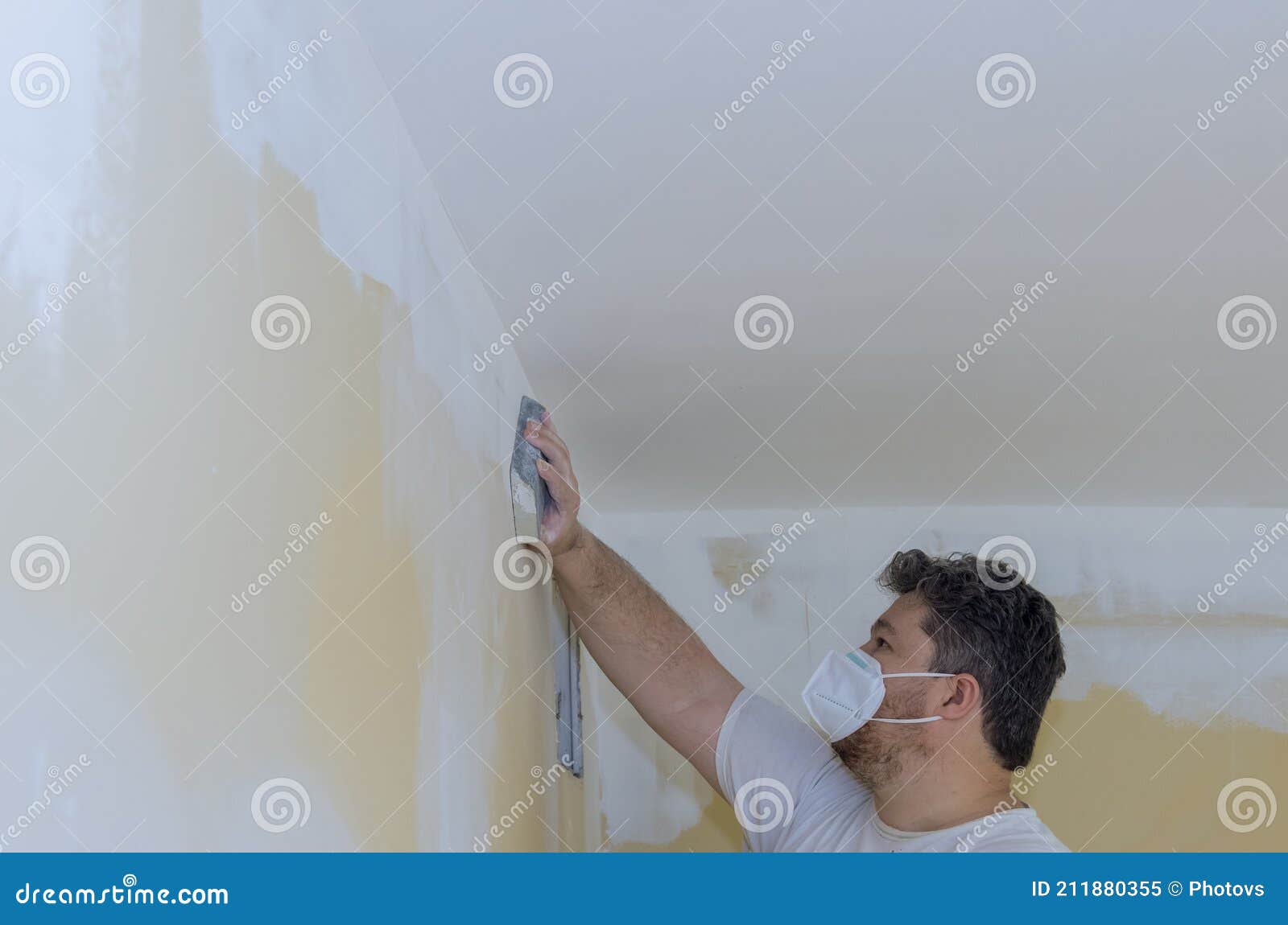 Worker Sanding the Drywall Mud Using Sand Trowel during Renovation the House Stock Image Image