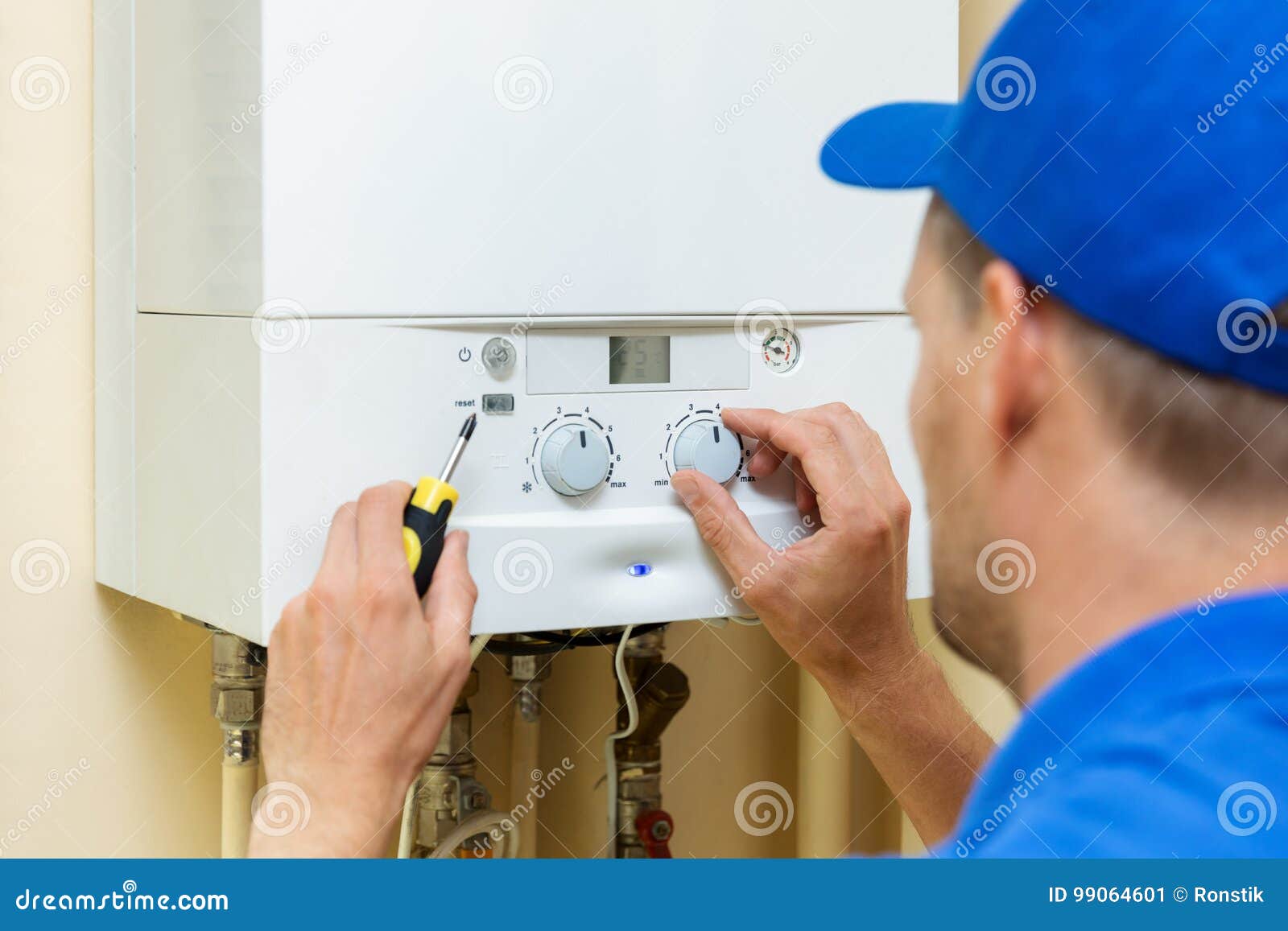 worker set up central gas heating boiler