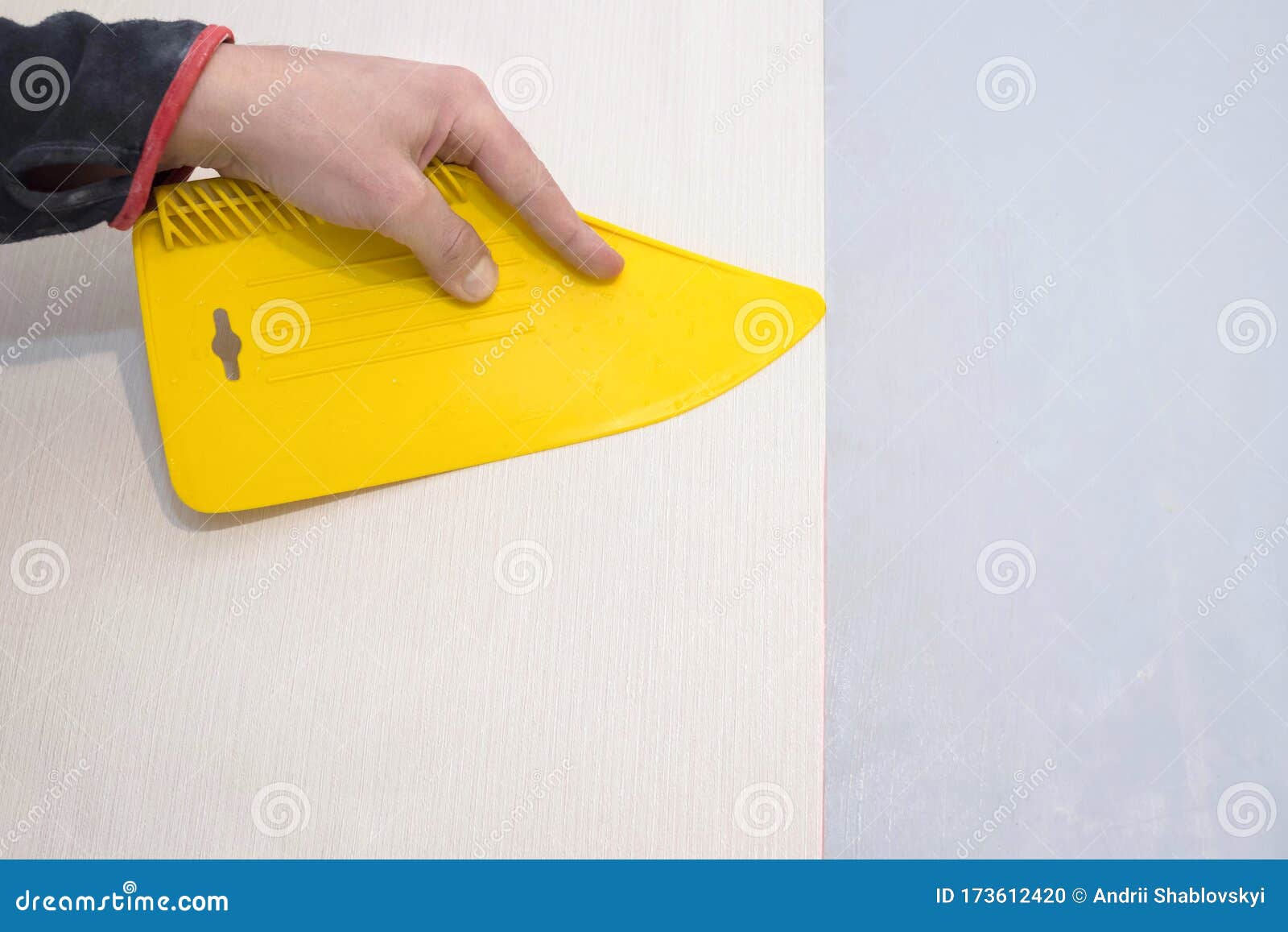 Download Worker Smoothes The Wallpaper With A Plastic Yellow Spatula Stock Photo Image Of Improvement Plastic 173612420 Yellowimages Mockups